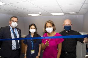 Munira Wilson cutting ribbon 01 - Audiology suite 13 June 2022